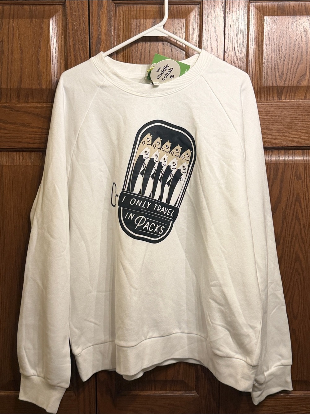 The Cuddle Collab White Graphic Adult Sweatshirt “I Only Travel in Packs”